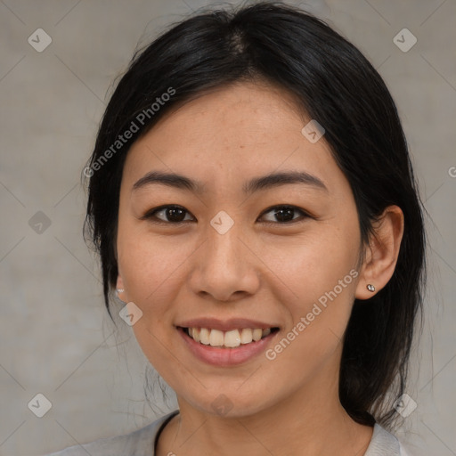 Joyful asian young-adult female with medium  black hair and brown eyes