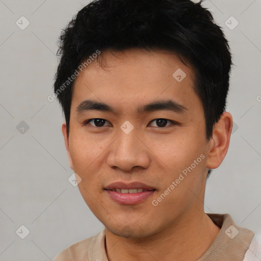 Joyful asian young-adult male with short  black hair and brown eyes