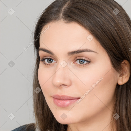 Neutral white young-adult female with long  brown hair and brown eyes