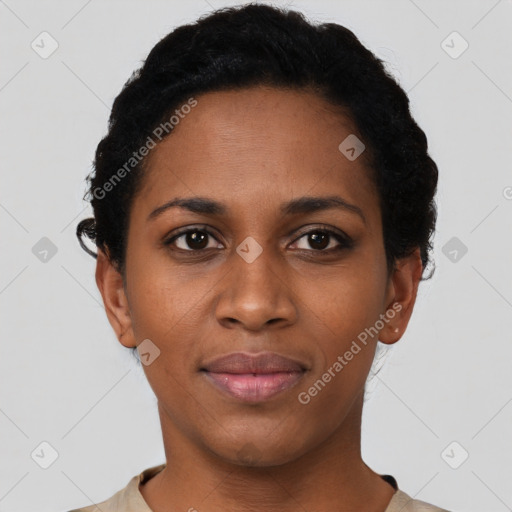 Joyful black young-adult female with short  black hair and brown eyes