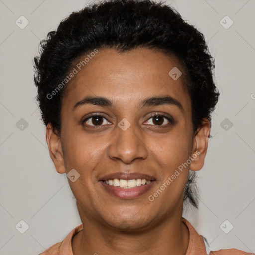 Joyful black young-adult female with short  brown hair and brown eyes