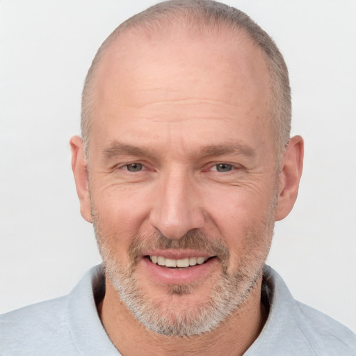 Joyful white middle-aged male with short  brown hair and brown eyes