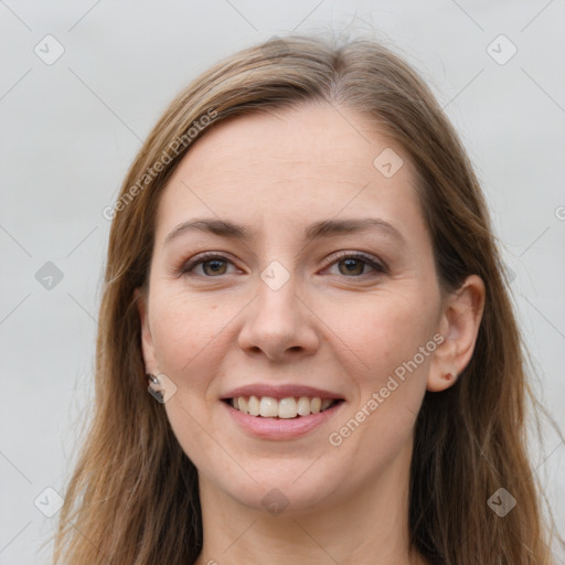 Joyful white young-adult female with long  brown hair and grey eyes