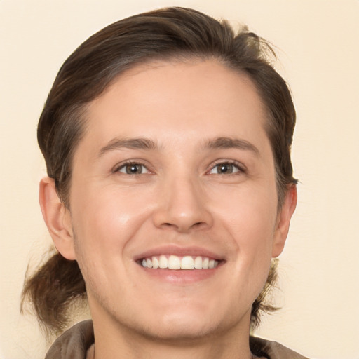 Joyful white young-adult male with medium  brown hair and brown eyes