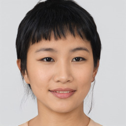 Joyful asian young-adult female with medium  black hair and brown eyes