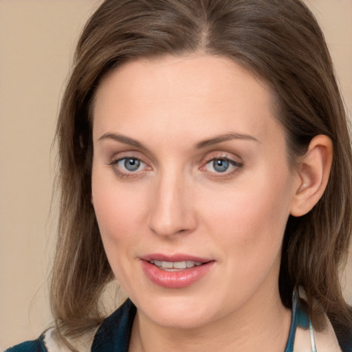 Joyful white young-adult female with medium  brown hair and blue eyes