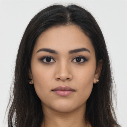 Neutral latino young-adult female with long  brown hair and brown eyes