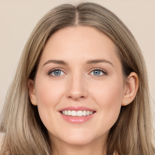 Joyful white young-adult female with long  brown hair and grey eyes