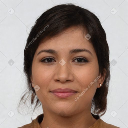 Joyful latino young-adult female with medium  brown hair and brown eyes