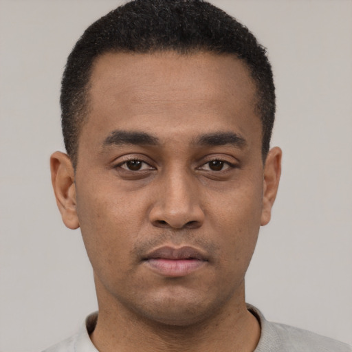 Neutral latino young-adult male with short  black hair and brown eyes