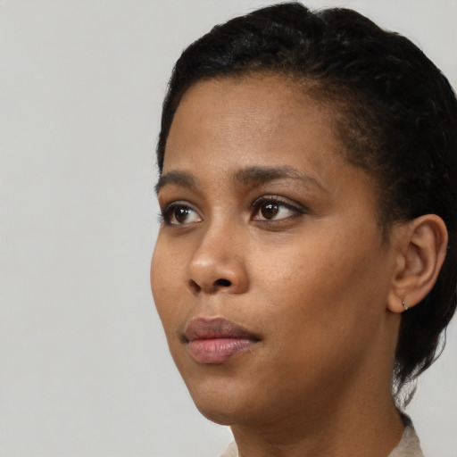 Neutral black young-adult female with short  black hair and brown eyes