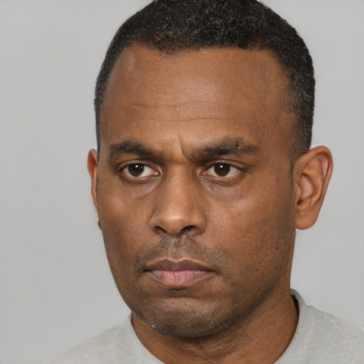 Neutral black adult male with short  black hair and brown eyes
