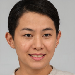 Joyful asian young-adult female with short  brown hair and brown eyes