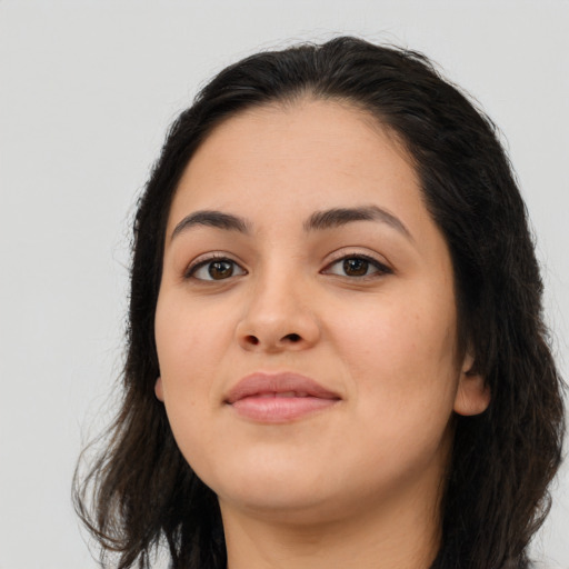 Joyful asian young-adult female with long  brown hair and brown eyes