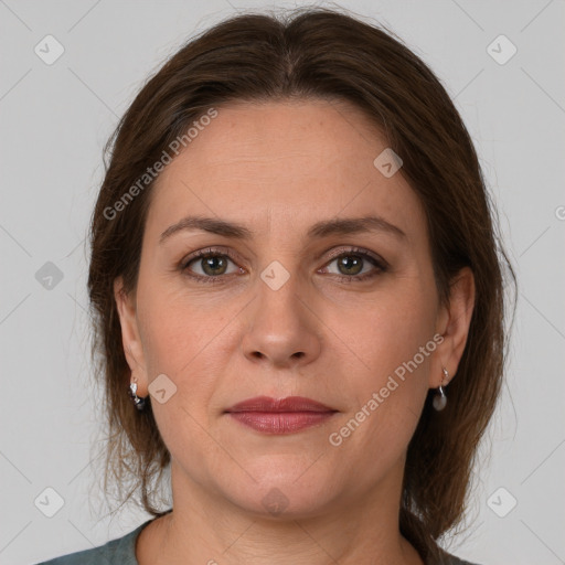 Joyful white adult female with medium  brown hair and grey eyes