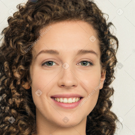 Joyful white young-adult female with medium  brown hair and green eyes