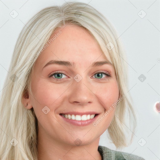 Joyful white young-adult female with long  blond hair and blue eyes