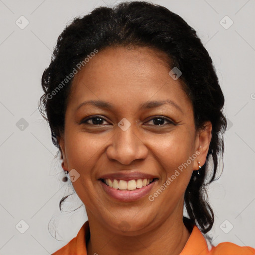 Joyful latino adult female with medium  brown hair and brown eyes