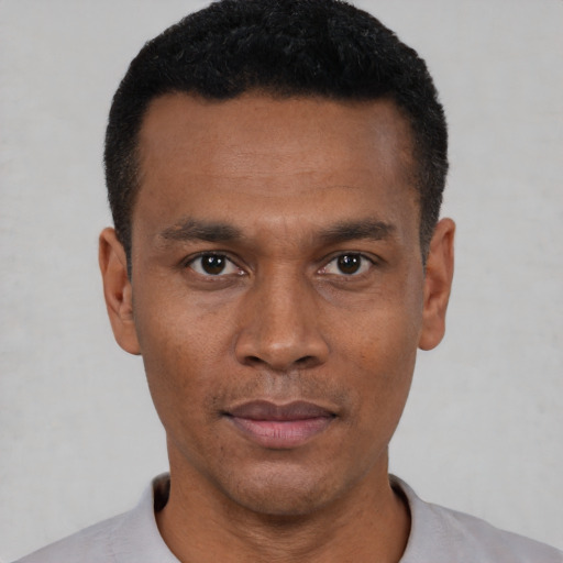 Neutral black young-adult male with short  black hair and brown eyes
