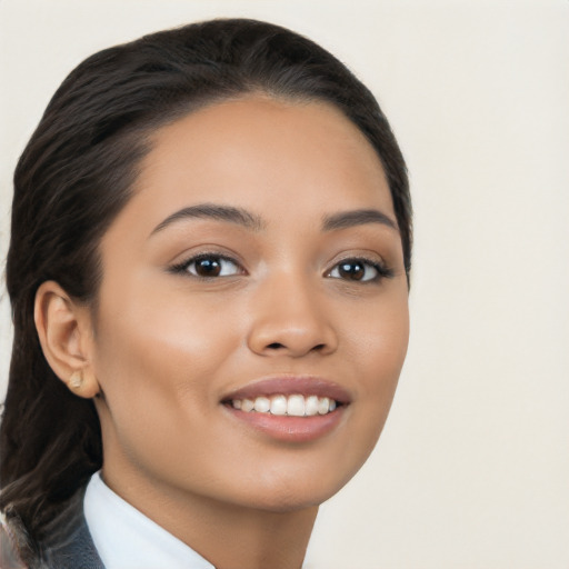 Joyful latino young-adult female with long  black hair and brown eyes