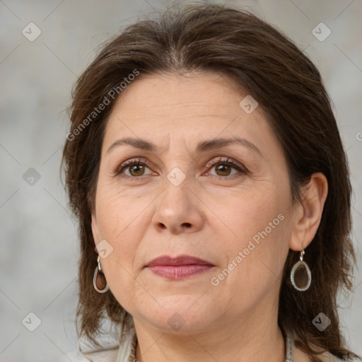 Joyful white adult female with medium  brown hair and brown eyes