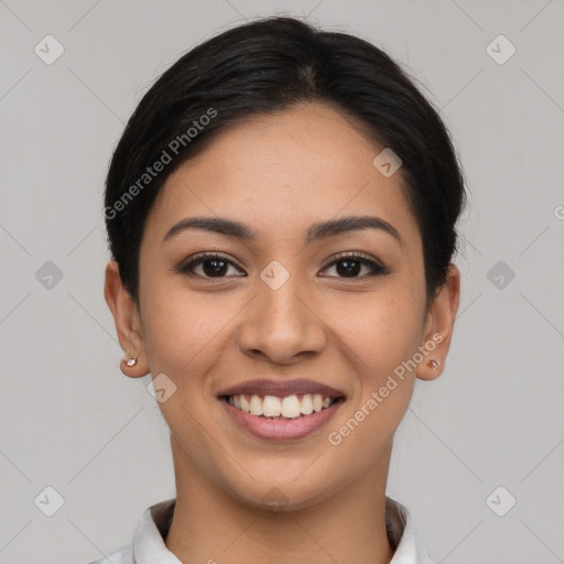 Joyful latino young-adult female with short  black hair and brown eyes