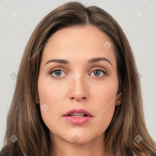 Neutral white young-adult female with long  brown hair and brown eyes