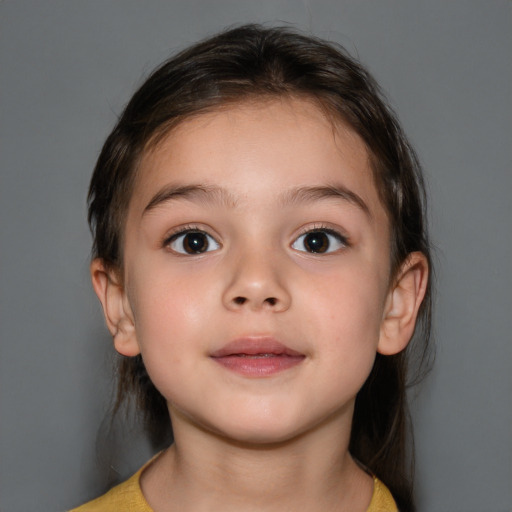 Joyful white child female with medium  brown hair and brown eyes