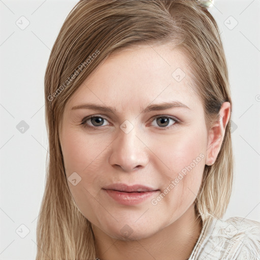 Joyful white young-adult female with long  brown hair and grey eyes