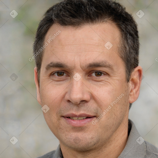 Joyful white adult male with short  brown hair and brown eyes