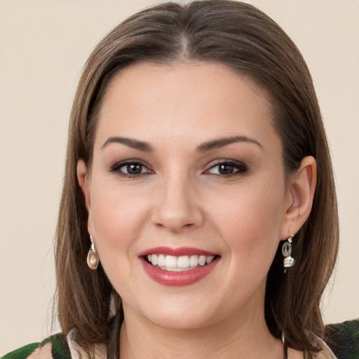 Joyful white young-adult female with long  brown hair and brown eyes