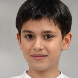 Joyful white child male with short  brown hair and brown eyes