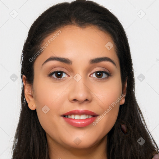 Joyful latino young-adult female with long  brown hair and brown eyes