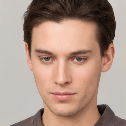 Neutral white young-adult male with short  brown hair and brown eyes