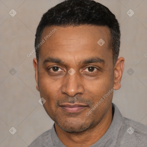 Joyful latino adult male with short  black hair and brown eyes