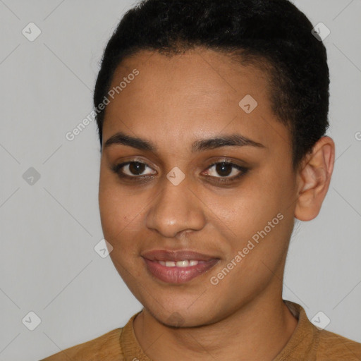 Joyful black young-adult female with short  black hair and brown eyes