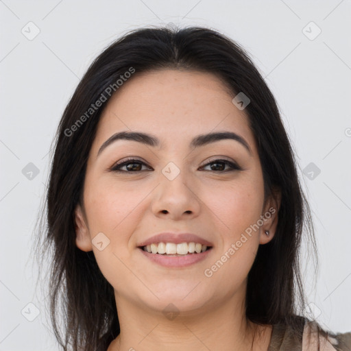 Joyful asian young-adult female with long  brown hair and brown eyes