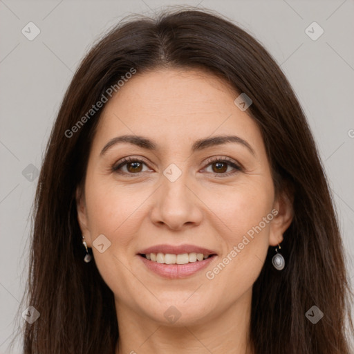 Joyful white young-adult female with long  brown hair and brown eyes