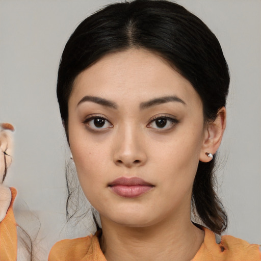 Neutral white young-adult female with medium  black hair and brown eyes