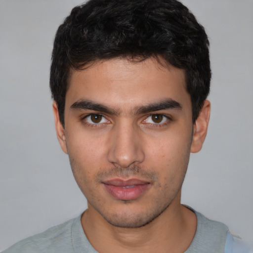 Neutral white young-adult male with short  black hair and brown eyes