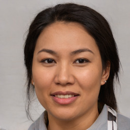 Joyful white adult female with medium  brown hair and brown eyes