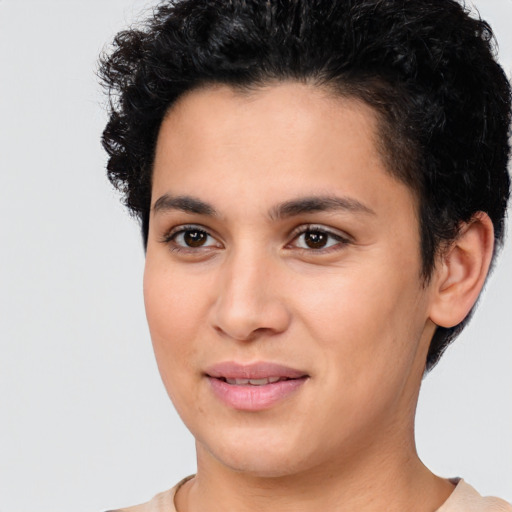 Joyful latino young-adult female with short  brown hair and brown eyes