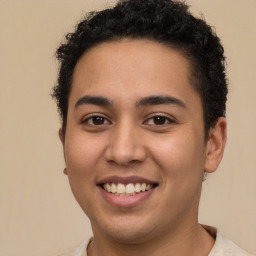 Joyful latino young-adult male with short  brown hair and brown eyes