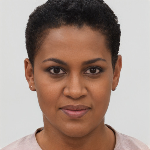Joyful black young-adult female with short  brown hair and brown eyes