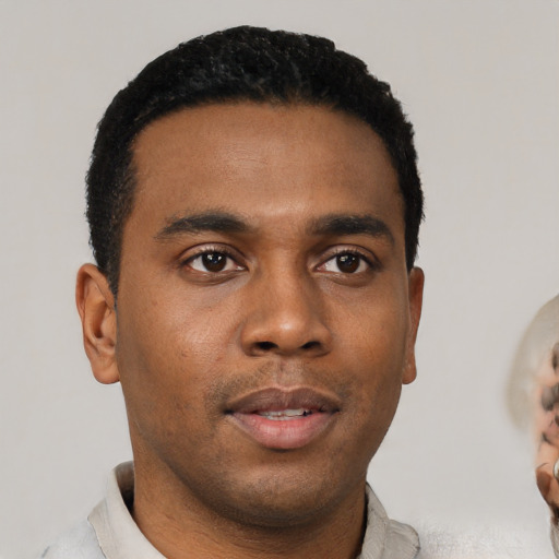 Neutral black young-adult male with short  black hair and brown eyes