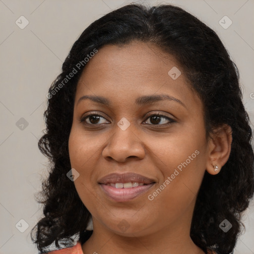 Joyful black young-adult female with medium  brown hair and brown eyes