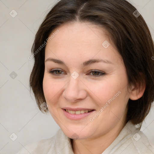 Joyful white young-adult female with medium  brown hair and brown eyes