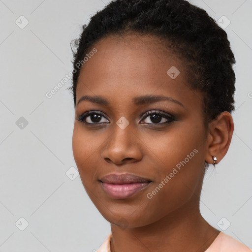 Joyful black young-adult female with short  black hair and brown eyes