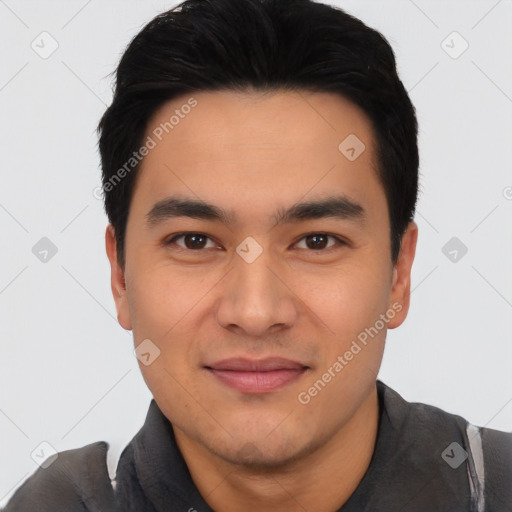 Joyful asian young-adult male with short  black hair and brown eyes