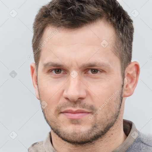 Neutral white young-adult male with short  brown hair and grey eyes